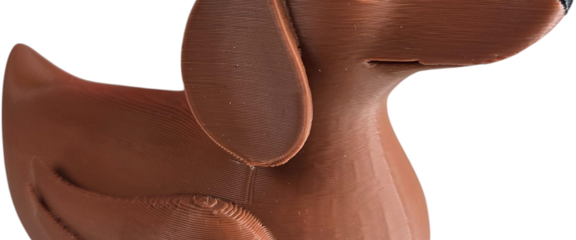 Brown dachshund-and-duck collectible, 3D printed in Quebec