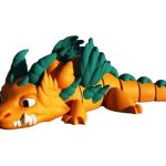 Articulated Orange Dragon Figure with Green Feathered Scales