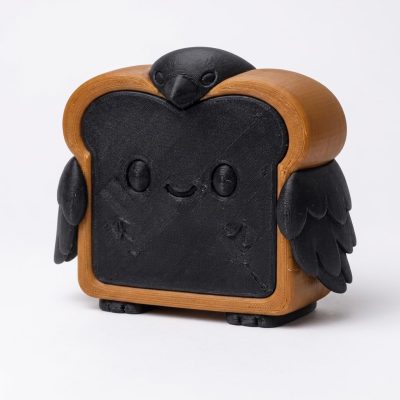 Black Raven Toast Collectible Figurine - Striking Black and Brown Desk Accent for Home or Office Decor - Unique Gift for Collectors - 3D Printed in Canada