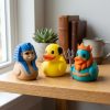 Lot de figurines Canard sphinx, pharaon et Poséidon
