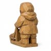 Figurine de meneur de traîneau à chiens sculptée façon bois